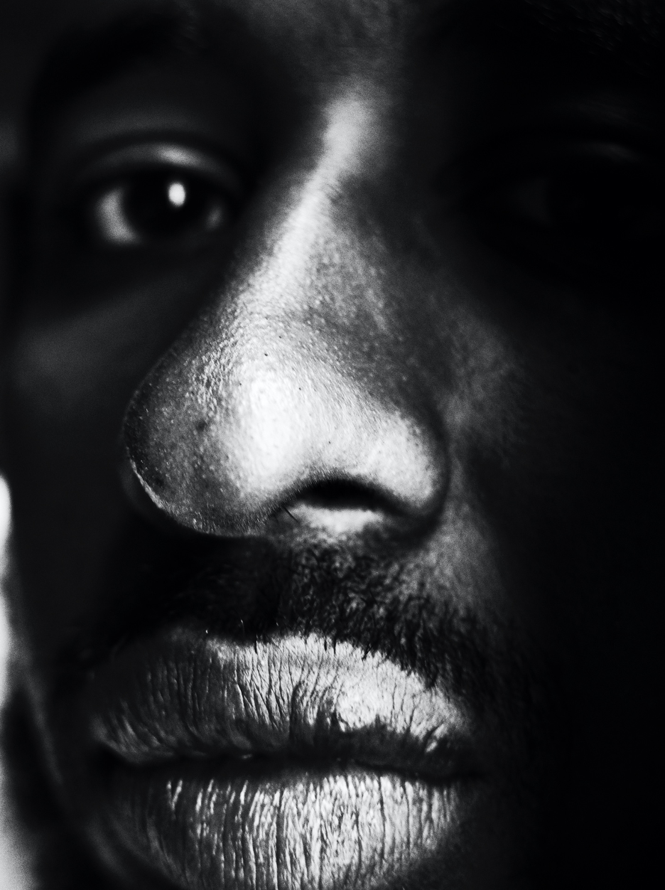 Close-up black-and-white photo of author's eyes, nose, and mouth